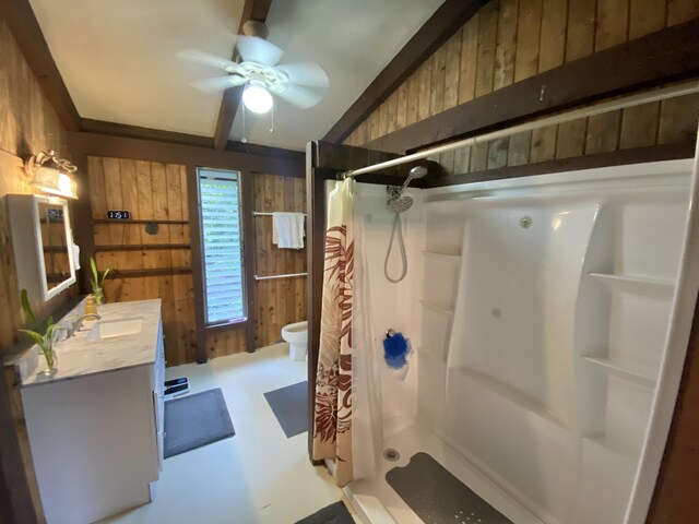 15-2773 Ono St, Pahoa, HI 96778 - bathroom with wood walls, a shower stall, vanity, a ceiling fan, and toilet