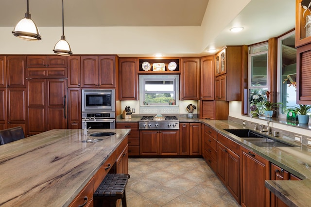 74-1026 Lawaia Rd, Holualoa, HI 96725 - kitchen featuring appliances with stainless steel finishes, dark stone countertops, a sink, hanging light fixtures, and glass insert cabinets