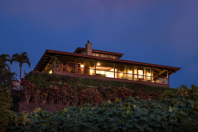 74-1026 Lawaia Rd, Holualoa, HI 96725 - back of house at twilight featuring a chimney