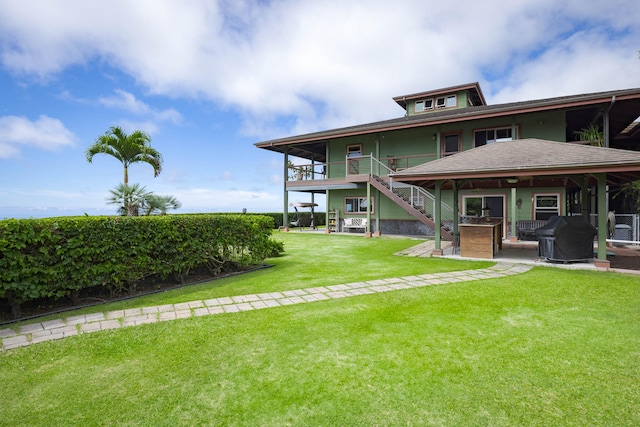 74-1026 Lawaia Rd, Holualoa, HI 96725 - rear view of house featuring stairway, a yard, and a patio
