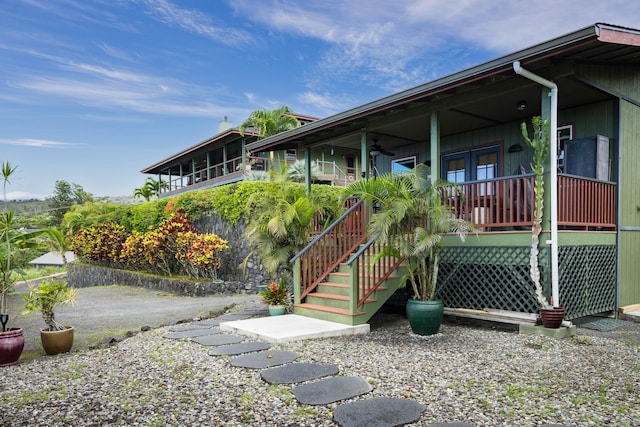 74-1026 Lawaia Rd, Holualoa, HI 96725 - view of property exterior featuring a porch, french doors, and ceiling fan