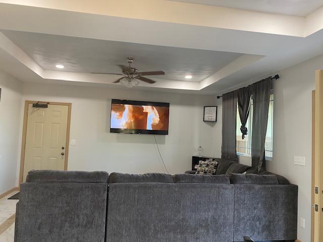 15-1852 33rd Ave, Keaau, HI 96749 - living room with a raised ceiling, a ceiling fan, recessed lighting, and baseboards
