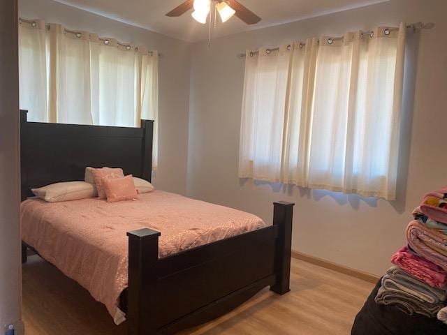 15-1852 33rd Ave, Keaau, HI 96749 - bedroom with light wood finished floors, baseboards, and ceiling fan