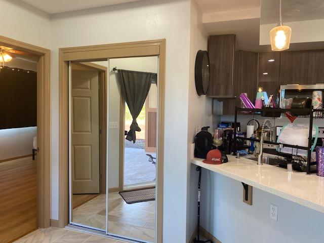 15-1852 33rd Ave, Keaau, HI 96749 - kitchen featuring light countertops, hanging light fixtures, and modern cabinets