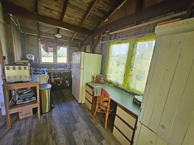 16-1745 35th Ave, Kurtistown, HI 96760 - kitchen featuring freestanding refrigerator, dark wood-type flooring, vaulted ceiling, and a sink