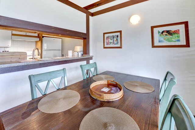 2253 Poipu Rd Unit 138, Koloa, HI 96756 - dining space with beam ceiling