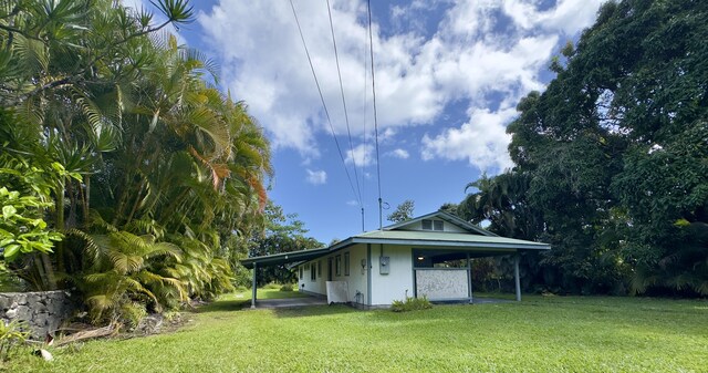 15-2689 Maikoiko St, Pahoa, HI 96778 - view of grassy yard featuring an attached carport