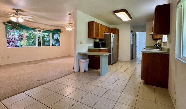 15-2689 Maikoiko St, Pahoa, HI 96778 - kitchen with appliances with stainless steel finishes, a sink, open floor plan, ceiling fan, and light tile patterned floors