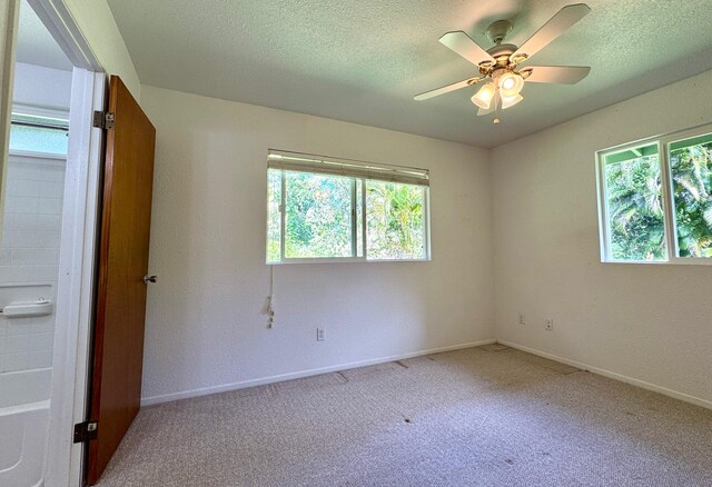 15-2689 Maikoiko St, Pahoa, HI 96778 - carpeted empty room with a ceiling fan, baseboards, and a textured ceiling
