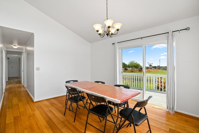 5060 Nonou Rd, Kapaa, HI 96746 - dining space featuring vaulted ceiling, a chandelier, light wood-style floors, and baseboards