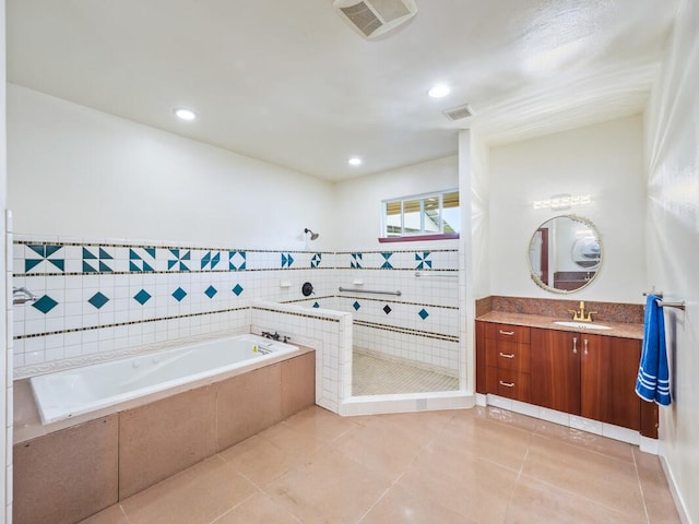 2089 Kinoole St, Hilo, HI 96720 - full bathroom with vanity, a garden tub, a tile shower, tile patterned floors, and recessed lighting