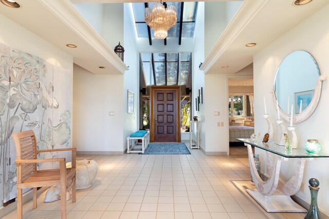 71-1638 Puu Napoo Dr, Kailua-Kona, HI 96740 - tiled foyer entrance featuring a high ceiling, a chandelier, baseboards, and recessed lighting