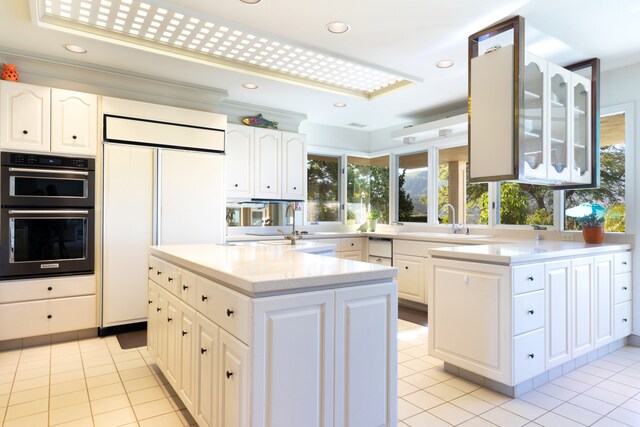 71-1638 Puu Napoo Dr, Kailua-Kona, HI 96740 - kitchen with paneled built in refrigerator, a sink, light countertops, glass insert cabinets, and light tile patterned flooring