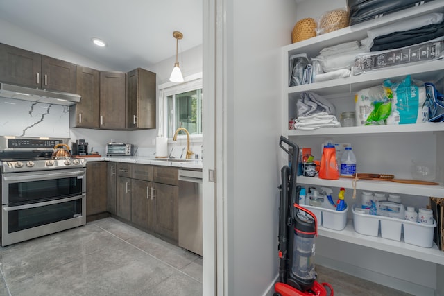 11-3366 Pa Alii St, Volcano, HI 96785 - kitchen featuring stainless steel appliances, a sink, under cabinet range hood, dark brown cabinets, and light countertops
