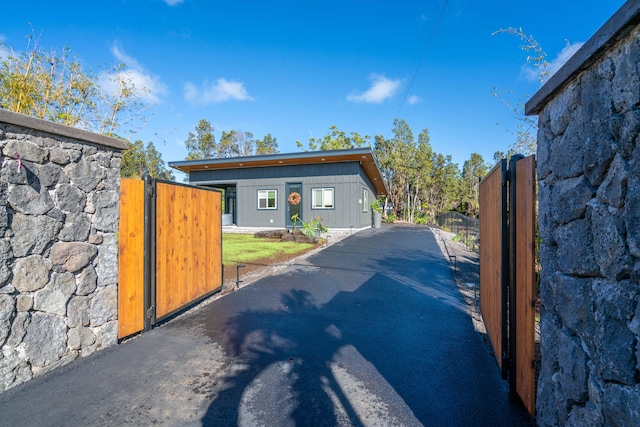 11-3366 Pa Alii St, Volcano, HI 96785 - view of asphalt driveway featuring a gate