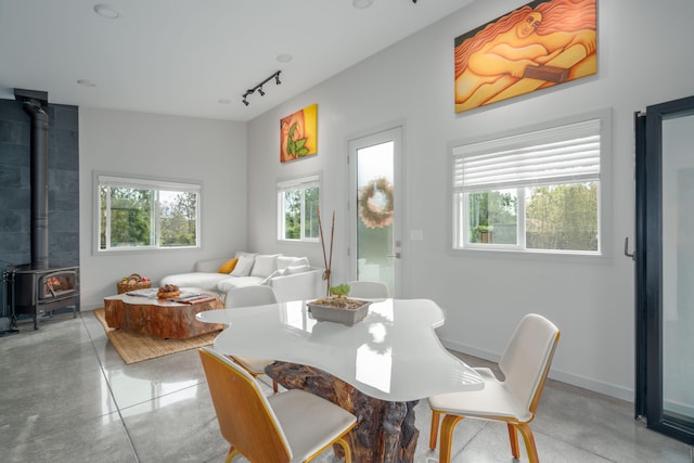 11-3366 Pa Alii St, Volcano, HI 96785 - dining room featuring a wood stove and track lighting