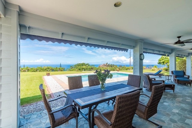 76-135 Kamehamalu St, Kailua-Kona, HI 96740 - view of patio / terrace featuring a ceiling fan, outdoor dining space, and an outdoor pool
