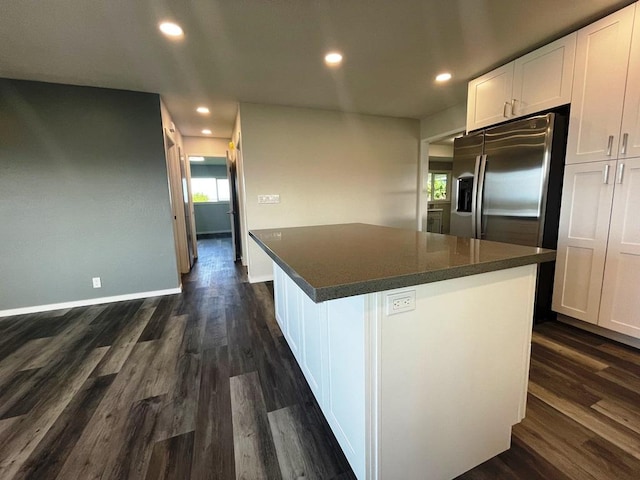 927 Puku St, Hilo, HI 96720 - kitchen featuring dark countertops, white cabinetry, dark wood finished floors, recessed lighting, and a center island