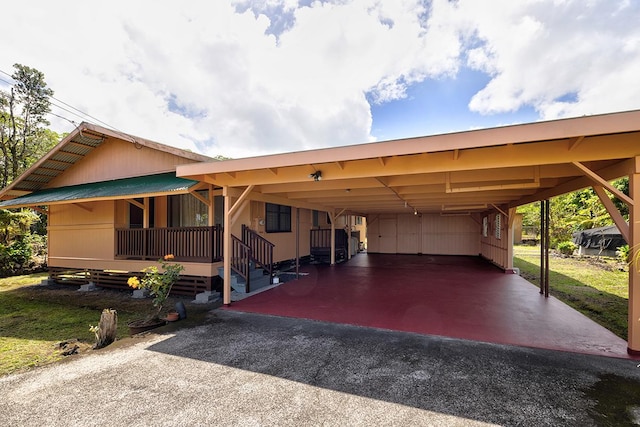 15-2026 33rd Ave, Keaau, HI 96749 - view of front facade with asphalt driveway, metal roof, and an attached carport