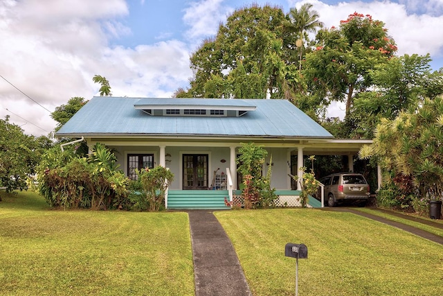 338 Kauila St, Hilo, HI 96720 - view of front of home featuring stucco siding, a front yard, french doors, metal roof, and covered porch