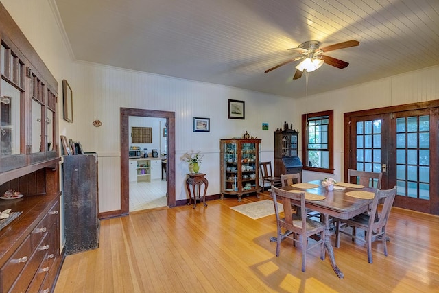 338 Kauila St, Hilo, HI 96720 - dining room featuring crown molding, light wood-style floors, a ceiling fan, baseboards, and french doors