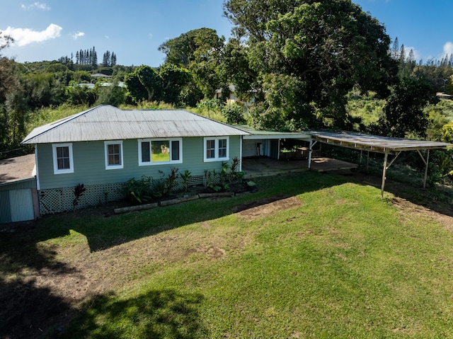 55-680 Hawi Rd, Hawi, HI 96719 - view of front of home with a front yard and metal roof