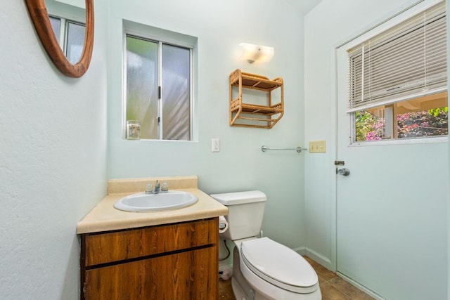 87-3219 Boki Rd, Captain Cook, HI 96704 - half bath featuring toilet, vanity, and tile patterned floors