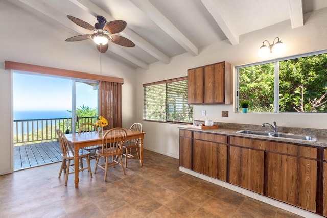 87-3219 Boki Rd, Captain Cook, HI 96704 - kitchen with a sink, brown cabinets, a ceiling fan, a water view, and dark countertops