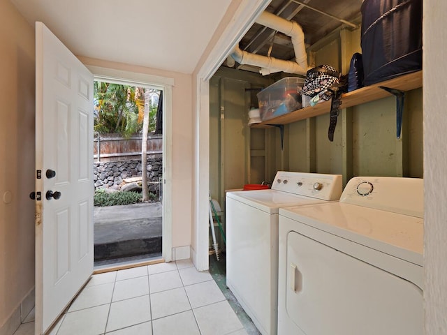 74-5114 Kumakani St, Kailua-Kona, HI 96740 - laundry room with washer and clothes dryer and light tile patterned floors