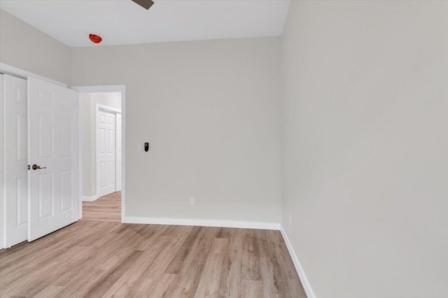 15-1517 Beach Rd, Keaau, HI 96749 - unfurnished bedroom with wood finished floors and baseboards
