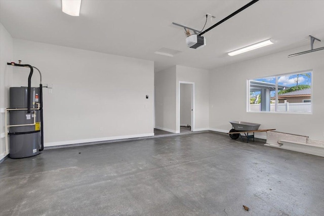 15-1517 Beach Rd, Keaau, HI 96749 - garage with water heater, a garage door opener, and baseboards