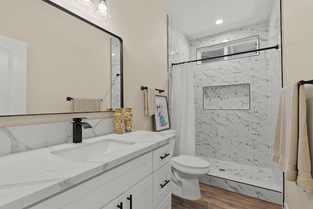 3905 Kila Pl, Hilo, HI 96720 - full bathroom with vanity, wood finished floors, toilet, and a marble finish shower