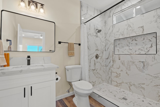 3905 Kila Pl, Hilo, HI 96720 - full bathroom featuring vanity, toilet, a marble finish shower, wood finished floors, and baseboards