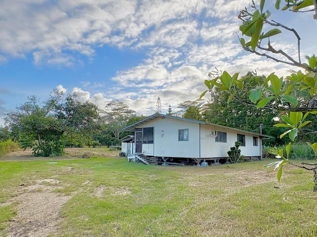 15-1698 19th Ave, Keaau, HI 96749 - view of home's exterior featuring a yard