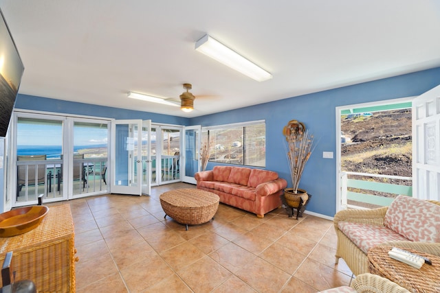 88-198 Aoao Ave, Captain Cook, HI 96704 - living room with light tile patterned flooring, a ceiling fan, baseboards, and french doors