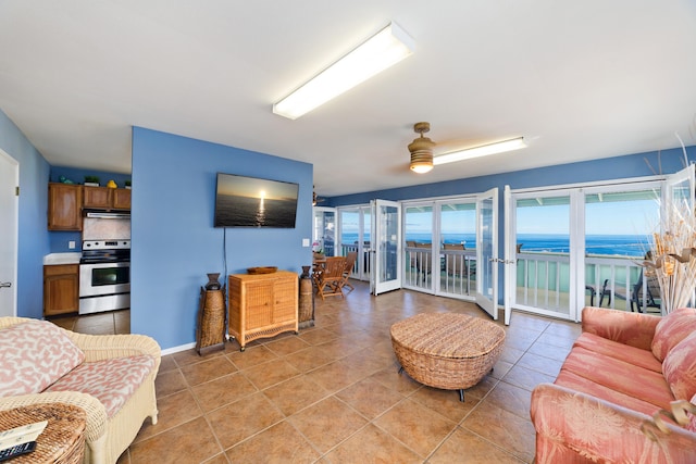 88-198 Aoao Ave, Captain Cook, HI 96704 - living area featuring light tile patterned flooring, a ceiling fan, and baseboards