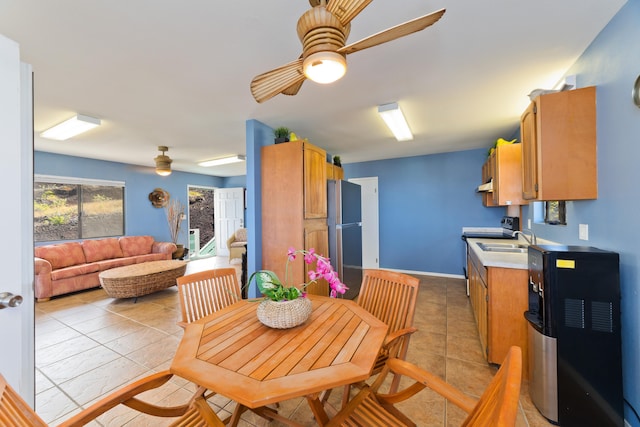 88-198 Aoao Ave, Captain Cook, HI 96704 - kitchen featuring ceiling fan, freestanding refrigerator, light tile patterned floors, a sink, and light countertops