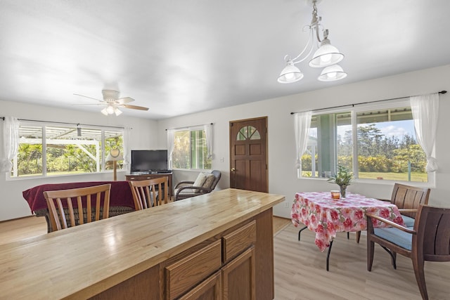 16-484 Laniuma St, Keaau, HI 96749 - kitchen with butcher block countertops, ceiling fan, pendant lighting, light wood-type flooring, and brown cabinets