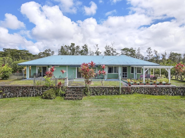 16-484 Laniuma St, Keaau, HI 96749 - view of front of house with metal roof and a front lawn