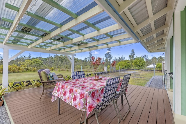 16-484 Laniuma St, Keaau, HI 96749 - wooden deck with outdoor dining area, a pergola, a lawn, and view of scattered trees