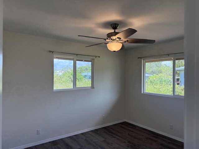 16-2051 Hale Way, Pahoa, HI 96778 - unfurnished room with dark wood-style flooring and ceiling fan