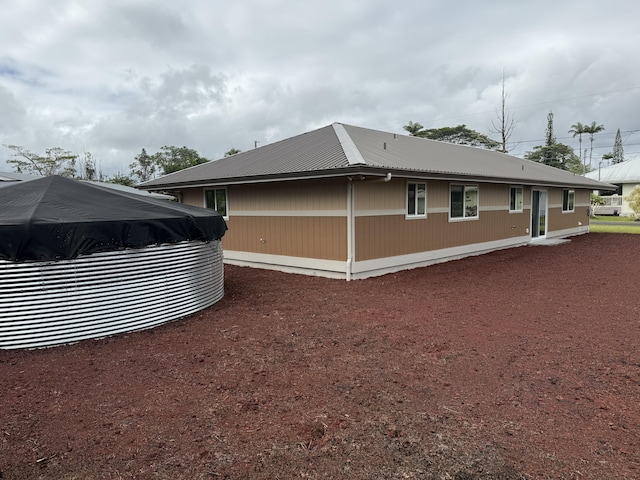 16-2051 Hale Way, Pahoa, HI 96778 - view of side of home with a metal roof