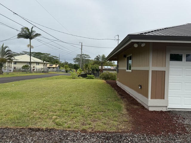 16-2051 Hale Way, Pahoa, HI 96778 - view of green lawn with a garage
