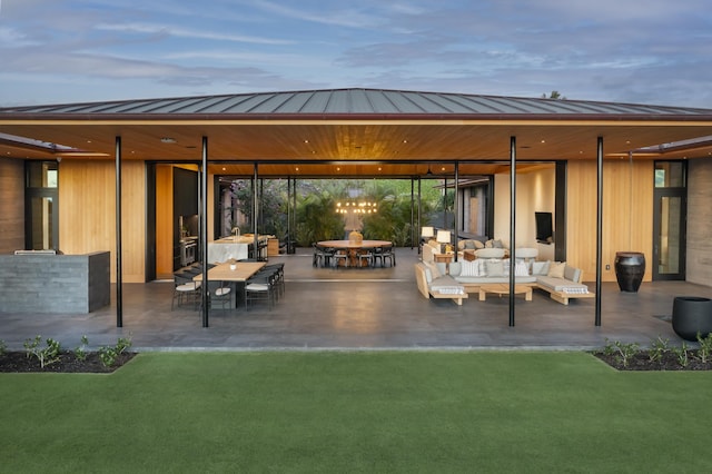 73-2210 Ala Kohanaiki, Kailua Kona, HI 96740 - back of house with a standing seam roof, metal roof, outdoor lounge area, a yard, and a patio