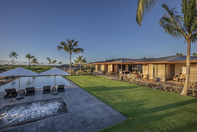 73-2210 Ala Kohanaiki, Kailua Kona, HI 96740 - view of grassy yard with a patio area and a fire pit