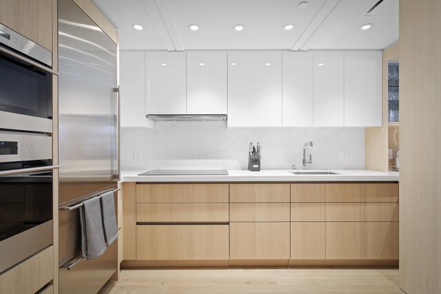 66-84 Kaunaoa Dr Unit C33, Kamuela, HI 96743 - kitchen featuring a sink, modern cabinets, stainless steel built in refrigerator, tasteful backsplash, and light countertops