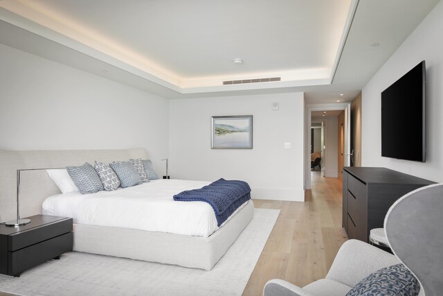 66-84 Kaunaoa Dr Unit C33, Kamuela, HI 96743 - bedroom with light wood-type flooring, a tray ceiling, baseboards, and recessed lighting