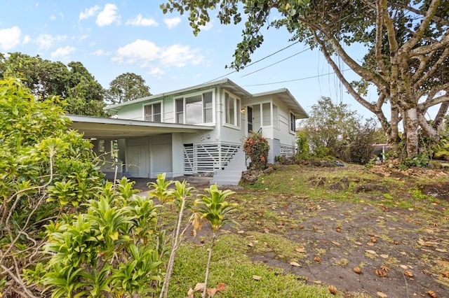 217 Haihai St, Hilo, HI 96720 - view of side of home with a carport