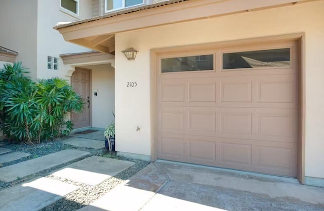 69-555 Waikoloa Beach Dr Unit 2105, Waikoloa, HI 96738 - entrance to property with stucco siding, a garage, and driveway