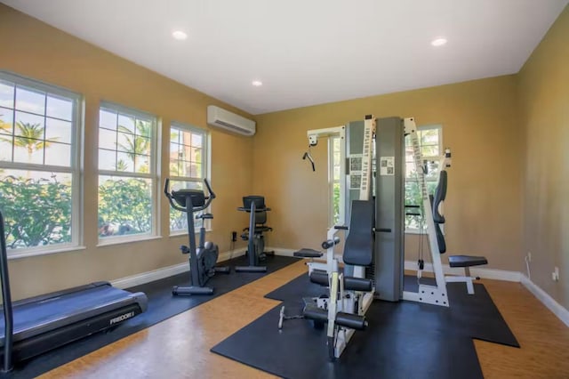 69-555 Waikoloa Beach Dr Unit 2105, Waikoloa, HI 96738 - workout area with a wall mounted air conditioner, plenty of natural light, baseboards, and recessed lighting